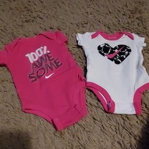 2 Nike onesies